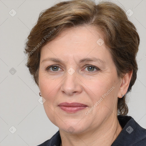 Joyful white adult female with medium  brown hair and grey eyes