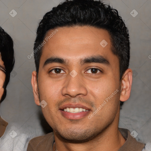 Joyful latino young-adult male with short  black hair and brown eyes