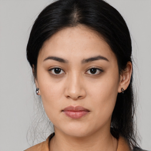 Joyful asian young-adult female with medium  black hair and brown eyes