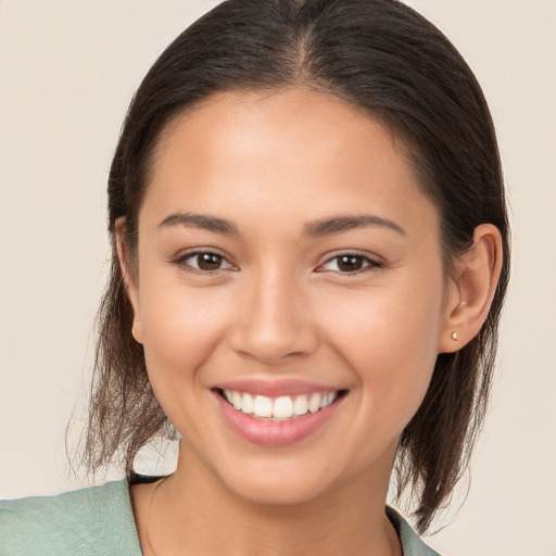 Joyful white young-adult female with medium  brown hair and brown eyes