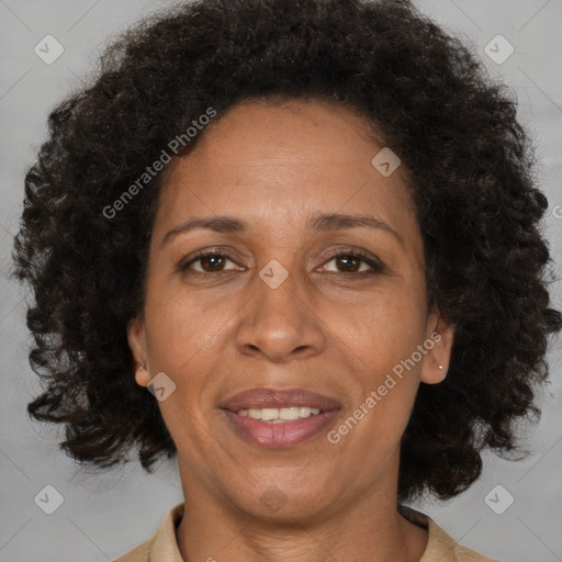 Joyful black adult female with medium  brown hair and brown eyes