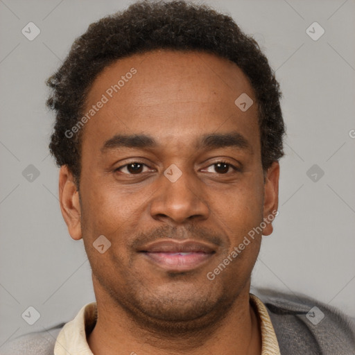 Joyful latino young-adult male with short  brown hair and brown eyes