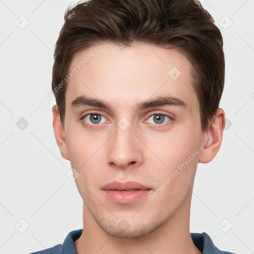 Neutral white young-adult male with short  brown hair and grey eyes