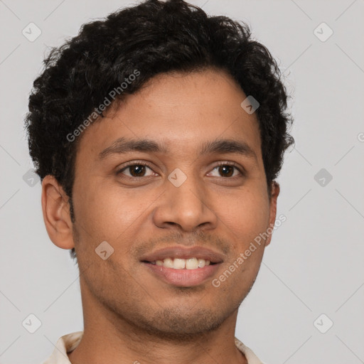 Joyful latino young-adult male with short  brown hair and brown eyes