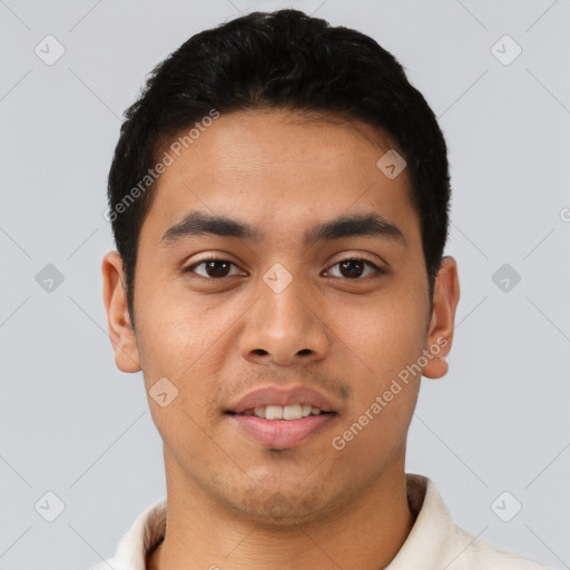 Joyful latino young-adult male with short  black hair and brown eyes