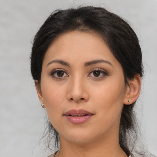 Neutral asian young-adult female with medium  brown hair and brown eyes