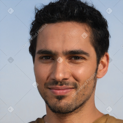 Joyful white young-adult male with short  black hair and brown eyes