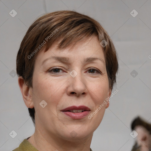 Joyful white adult female with medium  brown hair and grey eyes