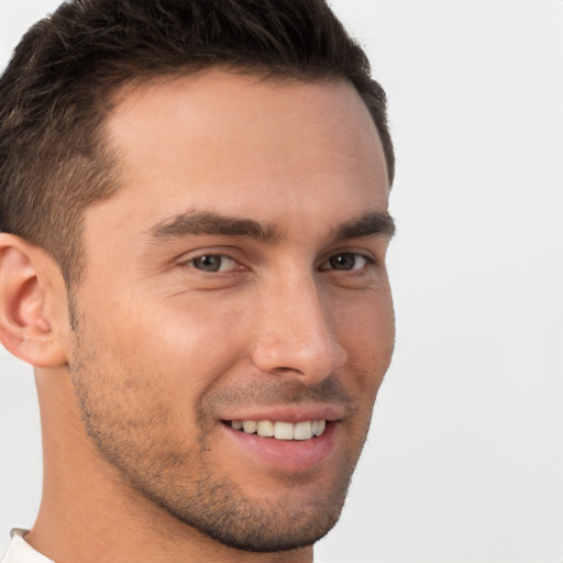 Joyful white young-adult male with short  brown hair and brown eyes