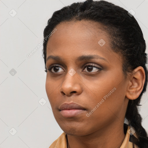 Neutral black young-adult female with short  black hair and brown eyes