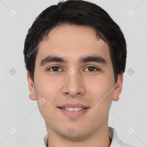 Joyful white young-adult male with short  black hair and brown eyes