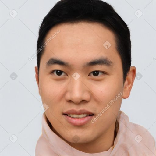 Joyful asian young-adult male with short  black hair and brown eyes