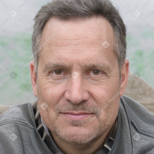 Joyful white middle-aged male with short  brown hair and brown eyes