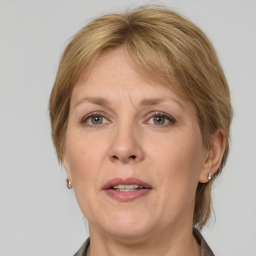 Joyful white adult female with medium  brown hair and grey eyes