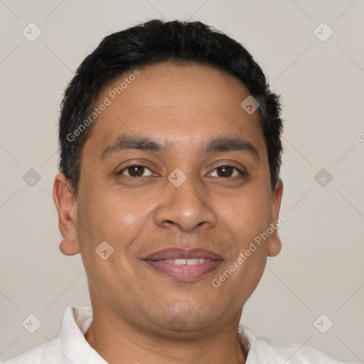 Joyful latino adult male with short  brown hair and brown eyes