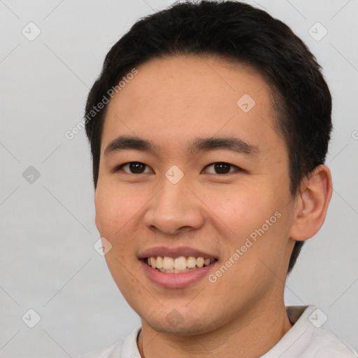 Joyful white young-adult male with short  black hair and brown eyes