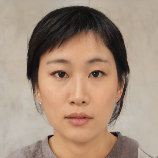 Neutral asian young-adult female with medium  black hair and brown eyes