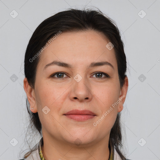 Joyful white adult female with medium  brown hair and brown eyes