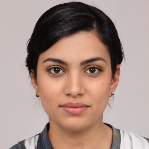 Joyful latino young-adult female with medium  black hair and brown eyes