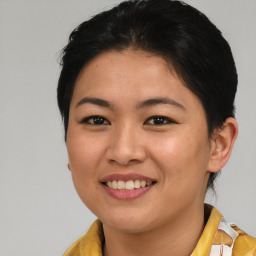 Joyful asian young-adult female with short  brown hair and brown eyes