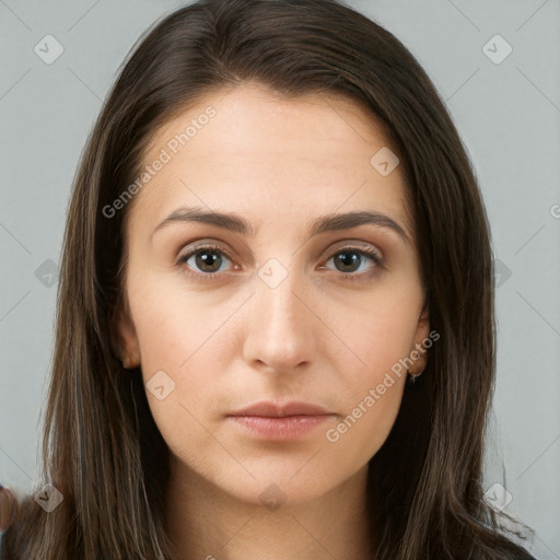 Neutral white young-adult female with long  brown hair and brown eyes