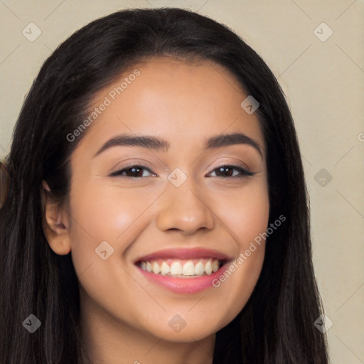 Joyful latino young-adult female with long  brown hair and brown eyes