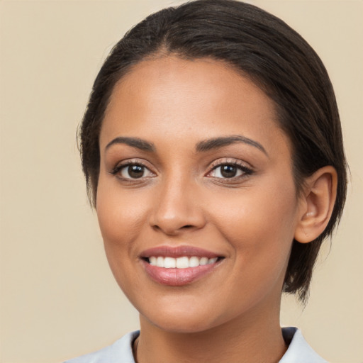 Joyful white young-adult female with medium  brown hair and brown eyes