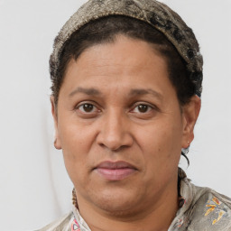 Joyful white adult female with short  brown hair and brown eyes