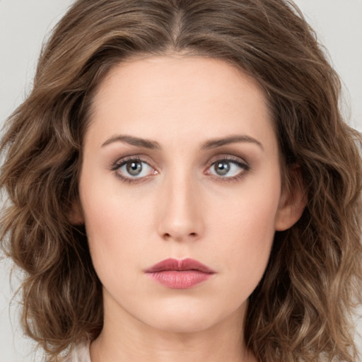 Neutral white young-adult female with long  brown hair and green eyes