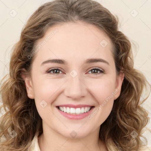 Joyful white young-adult female with long  brown hair and green eyes