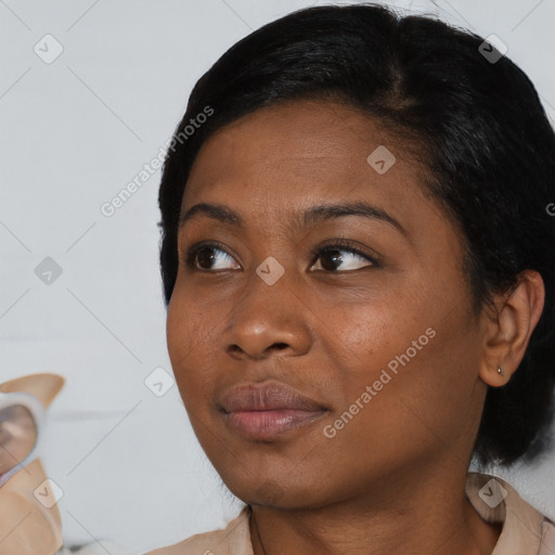 Joyful asian young-adult female with medium  black hair and brown eyes