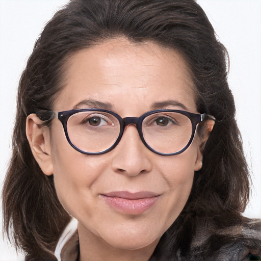 Joyful white adult female with long  brown hair and brown eyes