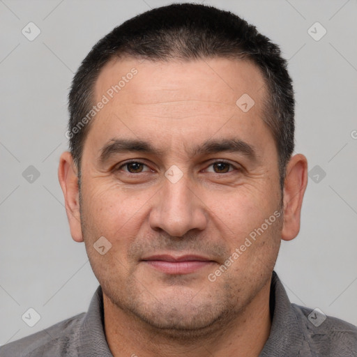 Joyful white adult male with short  brown hair and brown eyes