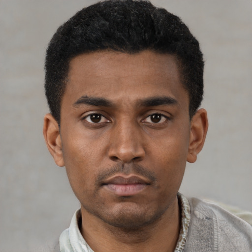 Neutral latino young-adult male with short  black hair and brown eyes