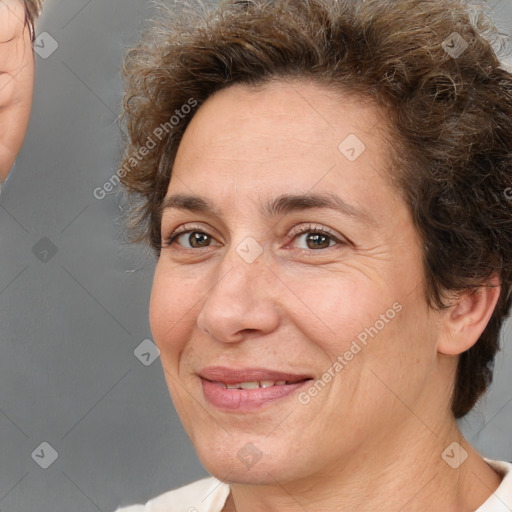 Joyful white adult female with short  brown hair and brown eyes