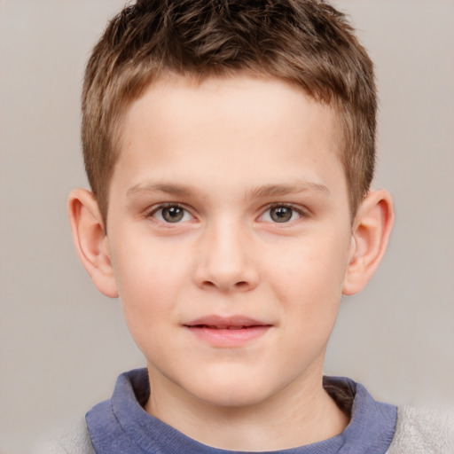 Joyful white child male with short  brown hair and grey eyes