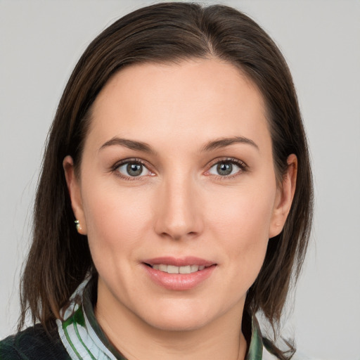 Joyful white young-adult female with medium  brown hair and brown eyes