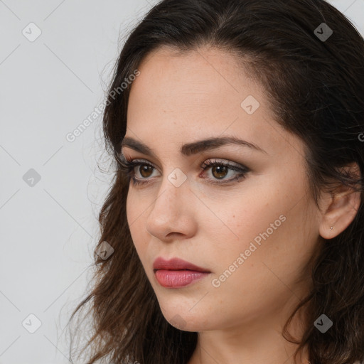 Neutral white young-adult female with long  brown hair and brown eyes