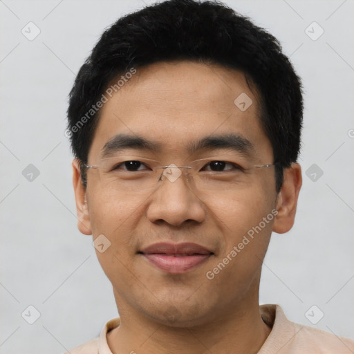 Joyful asian young-adult male with short  black hair and brown eyes