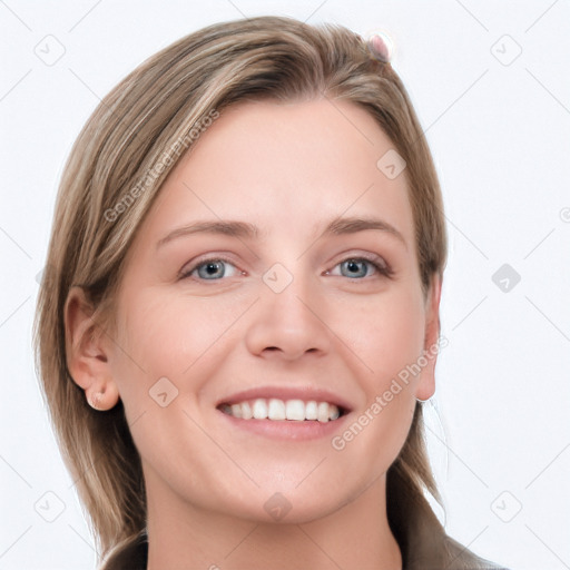 Joyful white young-adult female with long  brown hair and blue eyes