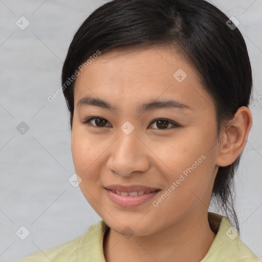 Joyful asian young-adult female with medium  brown hair and brown eyes