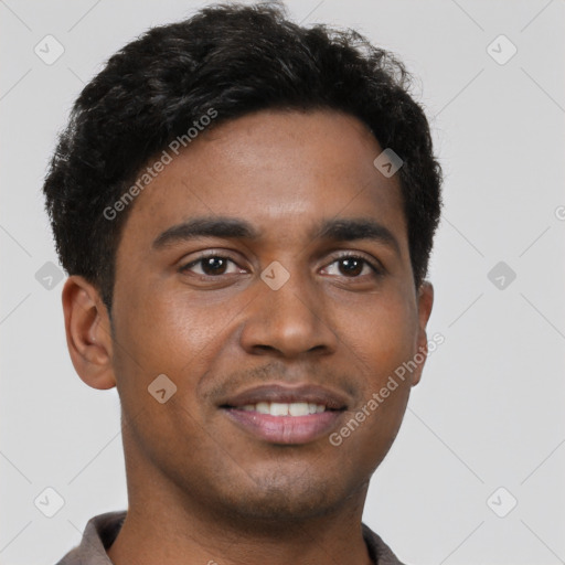 Joyful black young-adult male with short  brown hair and brown eyes