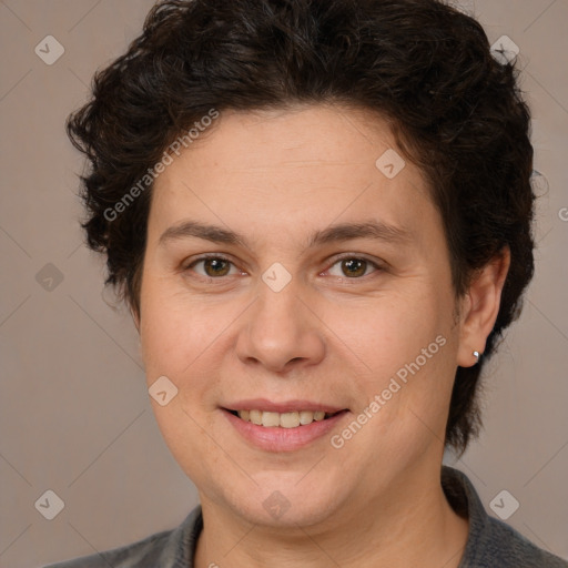 Joyful white adult female with medium  brown hair and brown eyes