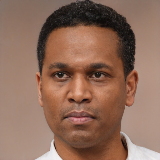 Neutral latino adult male with short  black hair and brown eyes