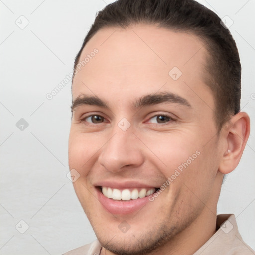 Joyful white young-adult male with short  brown hair and brown eyes