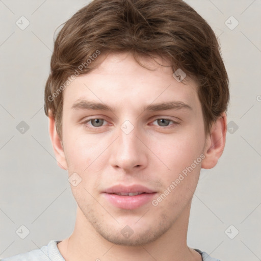 Neutral white young-adult male with short  brown hair and grey eyes