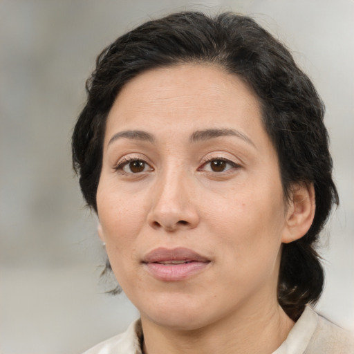 Joyful white adult female with medium  brown hair and brown eyes