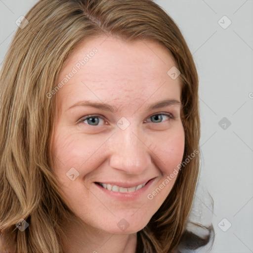 Joyful white young-adult female with long  brown hair and blue eyes