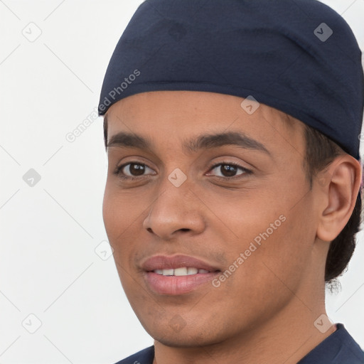 Joyful white young-adult male with short  black hair and brown eyes