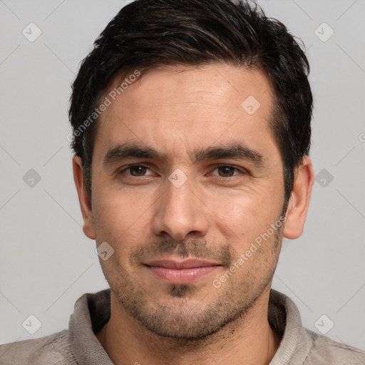 Joyful white young-adult male with short  black hair and brown eyes